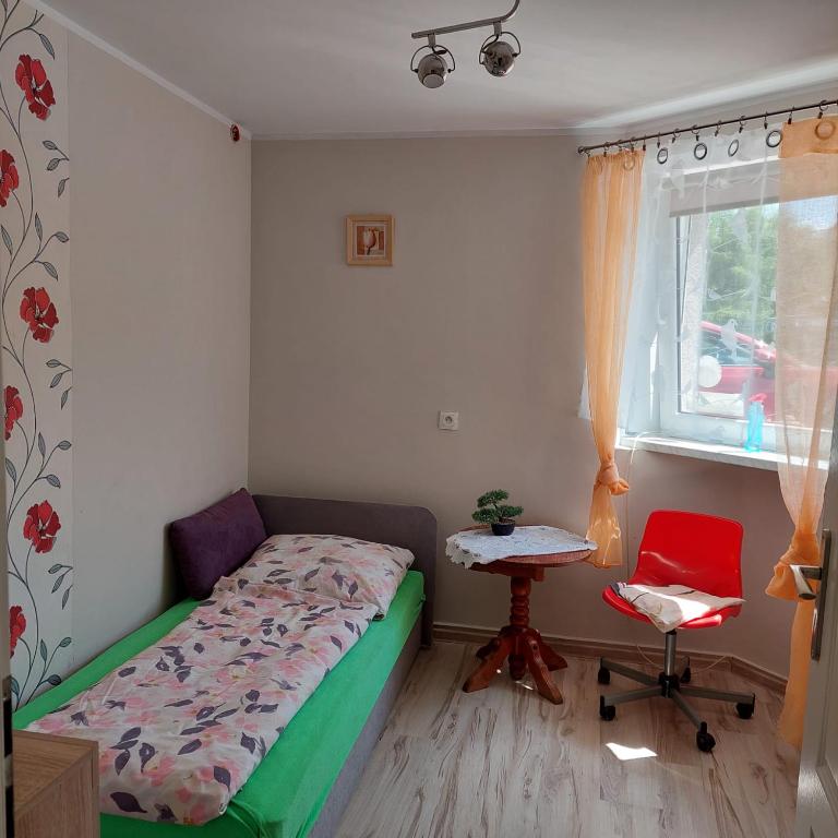 Postel nebo postele na pokoji v ubytování Pokoje Pod Dębowcem
