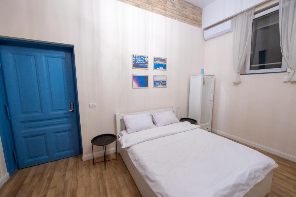 Postel nebo postele na pokoji v ubytování VISAJ Deluxe Downtown