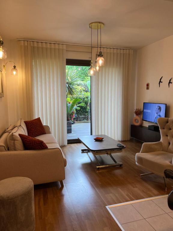 Un lugar para sentarse en Luxueux appartement 4 personnes - Parking gratuit - 20 min de Paris