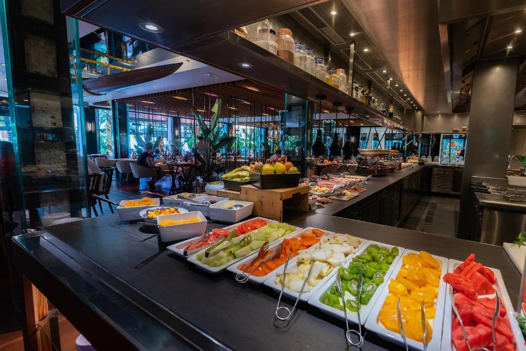 a buffet line with different types of fruits and vegetables at Parque Santiago III Official in Playa de las Americas
