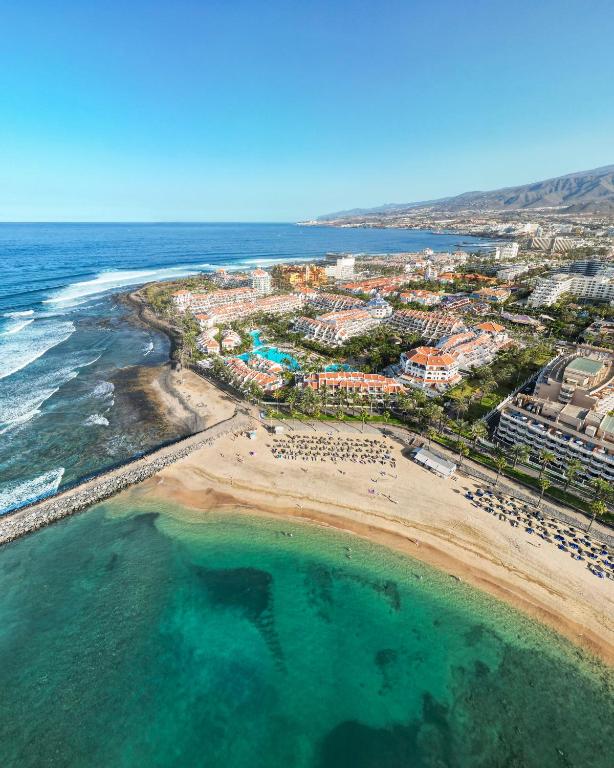 an aerial view of a beach and the ocean at Parque Santiago III Official in Playa de las Americas