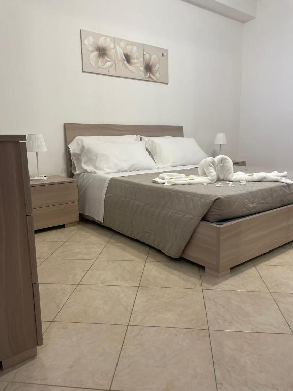 Postel nebo postele na pokoji v ubytování FlorAngè guest house