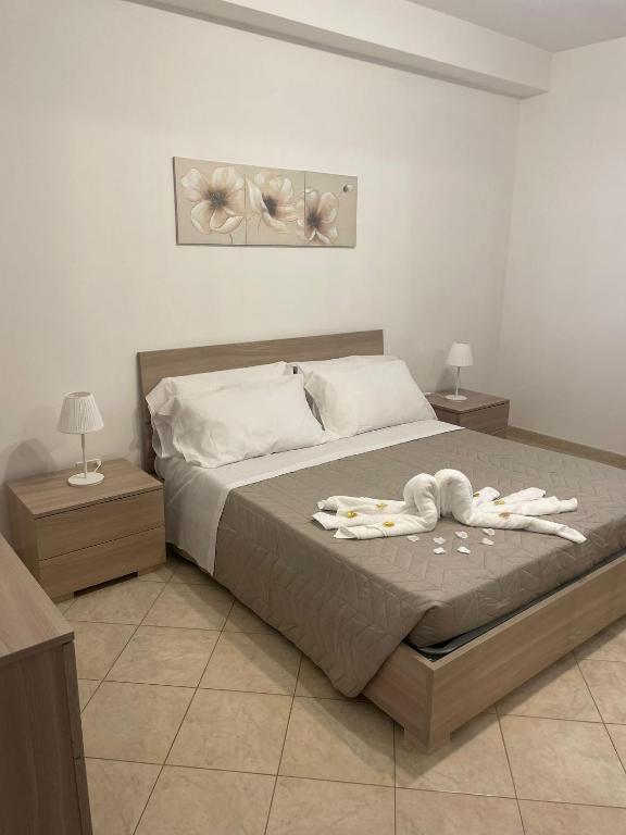 Postel nebo postele na pokoji v ubytování FlorAngè guest house