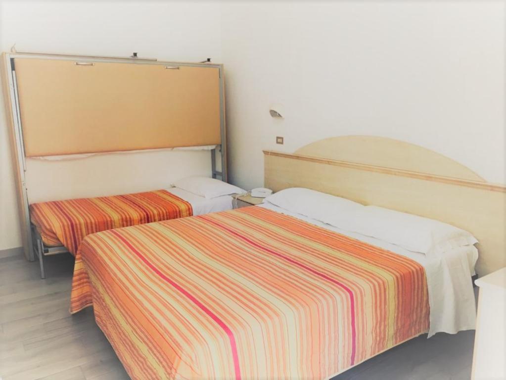 Postel nebo postele na pokoji v ubytování Park Hotel Pineta