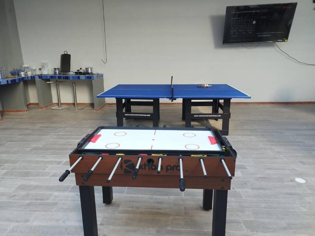 a ping pong table in a room with at Bm-15 room near the sea with air conditioning and WIFI in Cartagena de Indias