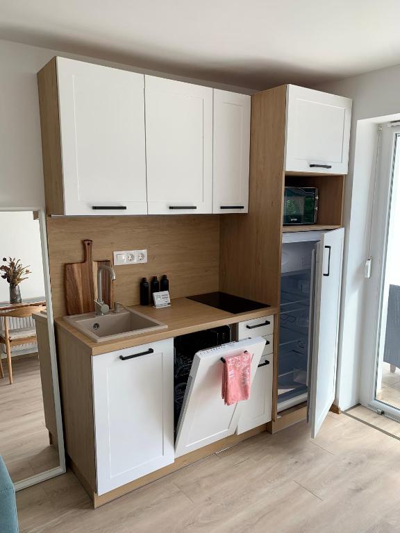 Kuchyň nebo kuchyňský kout v ubytování Nono Apartman Bükfürdő