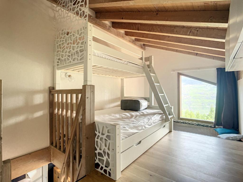 Posteľ alebo postele v izbe v ubytovaní La Plagne-les Coches vue Mont Blanc 6 pers piscine sauna