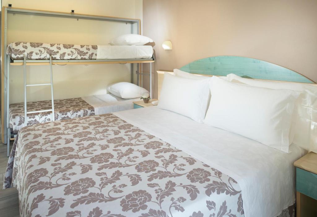 Postel nebo postele na pokoji v ubytování Park Hotel Pineta