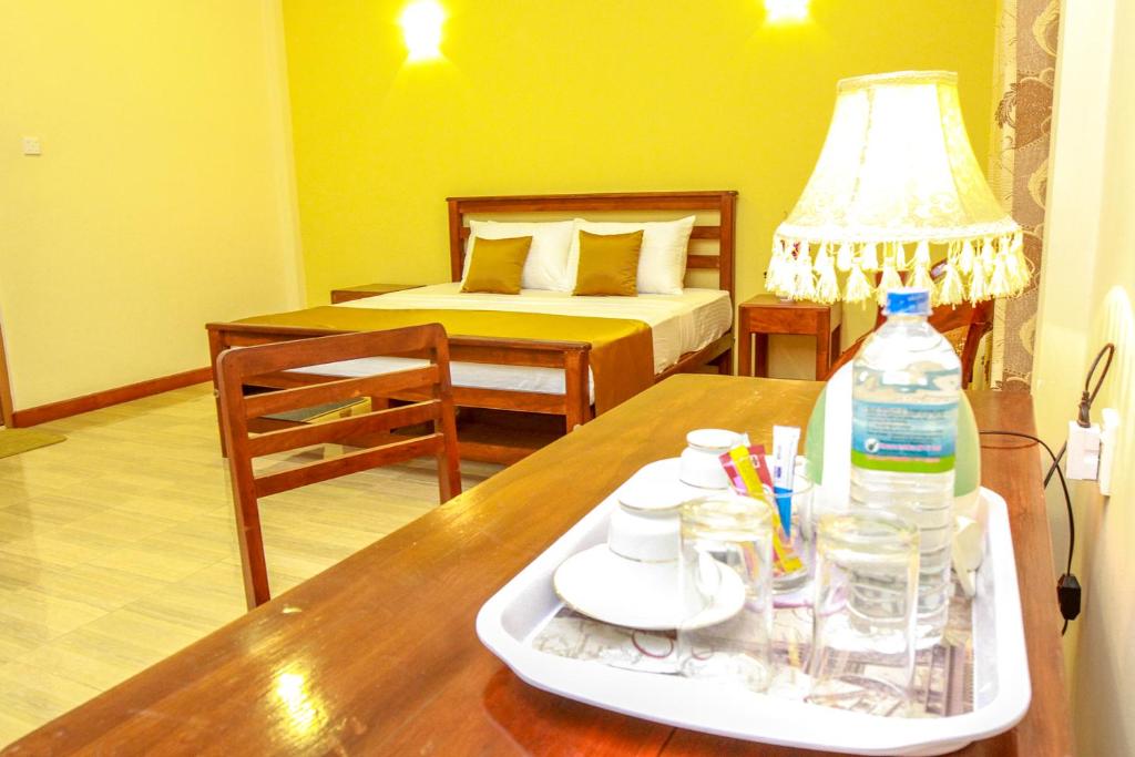 Postel nebo postele na pokoji v ubytování Hotel Nilketha Yala Tissamaharama