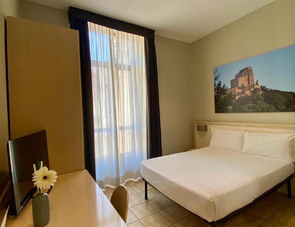 Postel nebo postele na pokoji v ubytování Best Quality Hotel Dock Milano