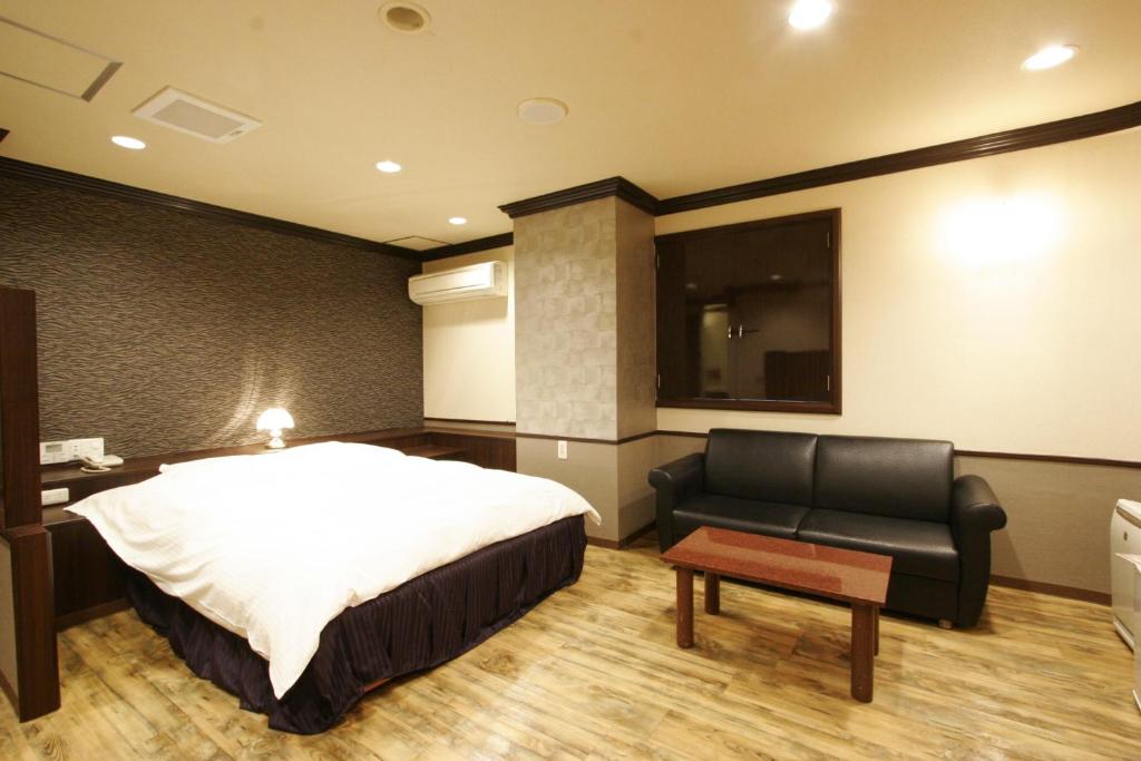 Postel nebo postele na pokoji v ubytování Hotel Joy (Adult Only)
