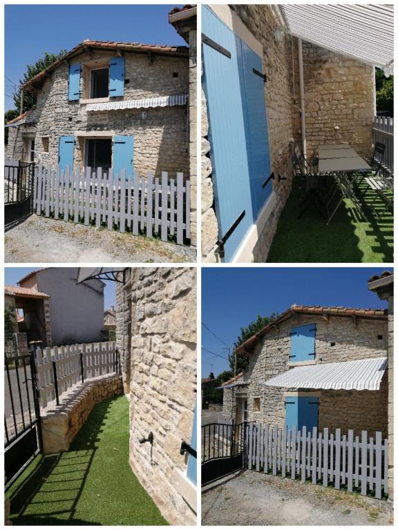 a brick house with blue doors and a white fence at Gite Bin Benaise sans linge in Pamproux