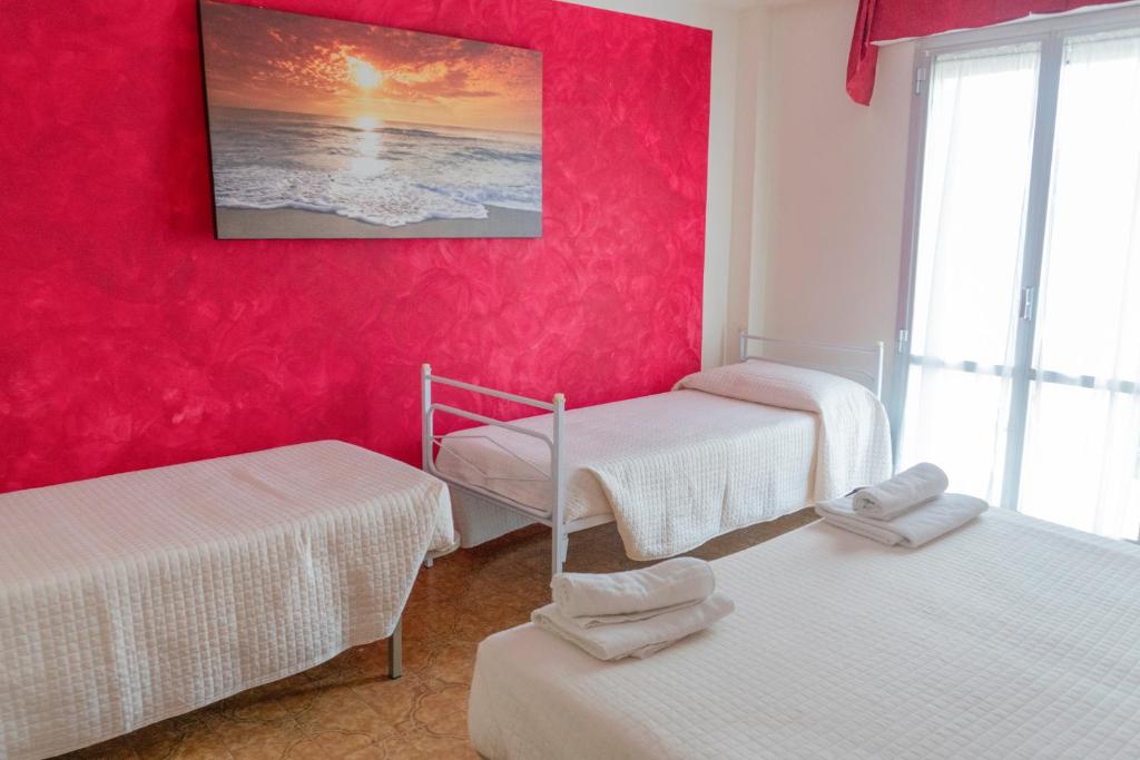 Postel nebo postele na pokoji v ubytování Hotel Maxim