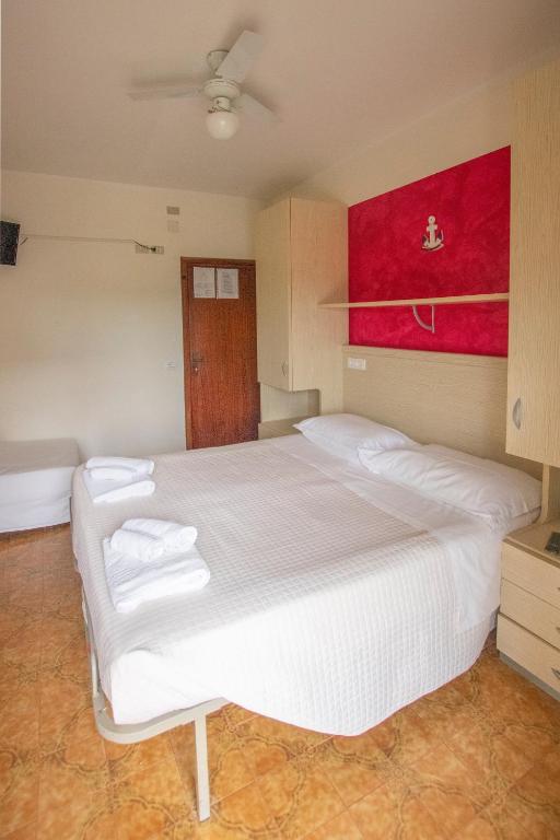 Postel nebo postele na pokoji v ubytování Hotel Maxim