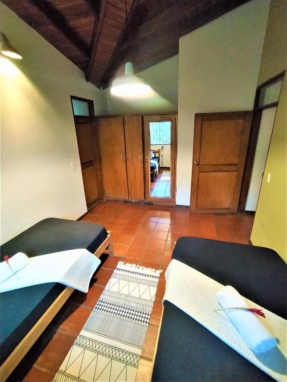 Postel nebo postele na pokoji v ubytování Finca Hostal Bolivar - Casa Quinta