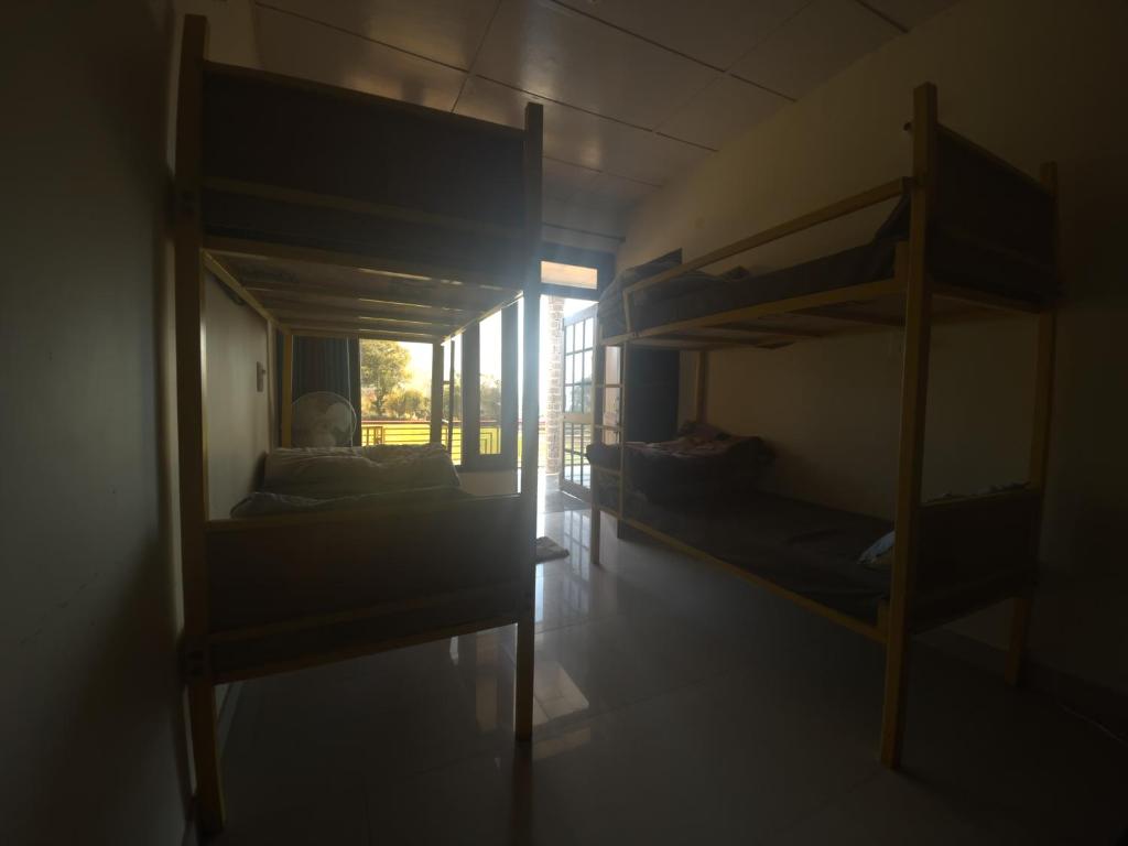 Postel nebo postele na pokoji v ubytování Bir Nest Hostel