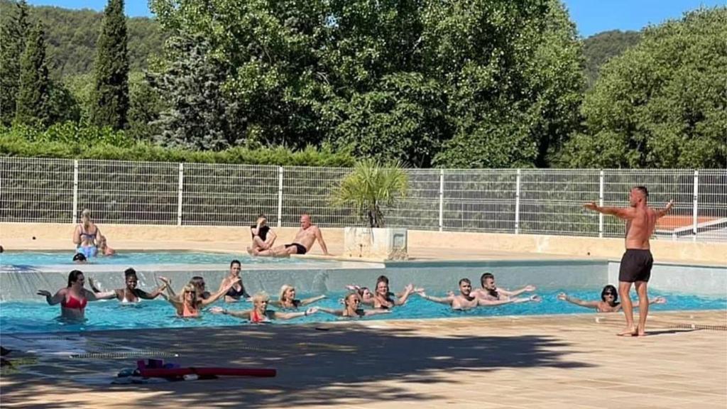 a group of people in a swimming pool at Koko Holidays at Camping La Foux in Draguignan