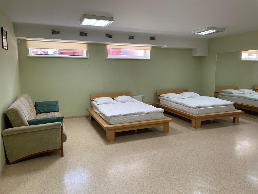 Postel nebo postele na pokoji v ubytování Aismares Hostel