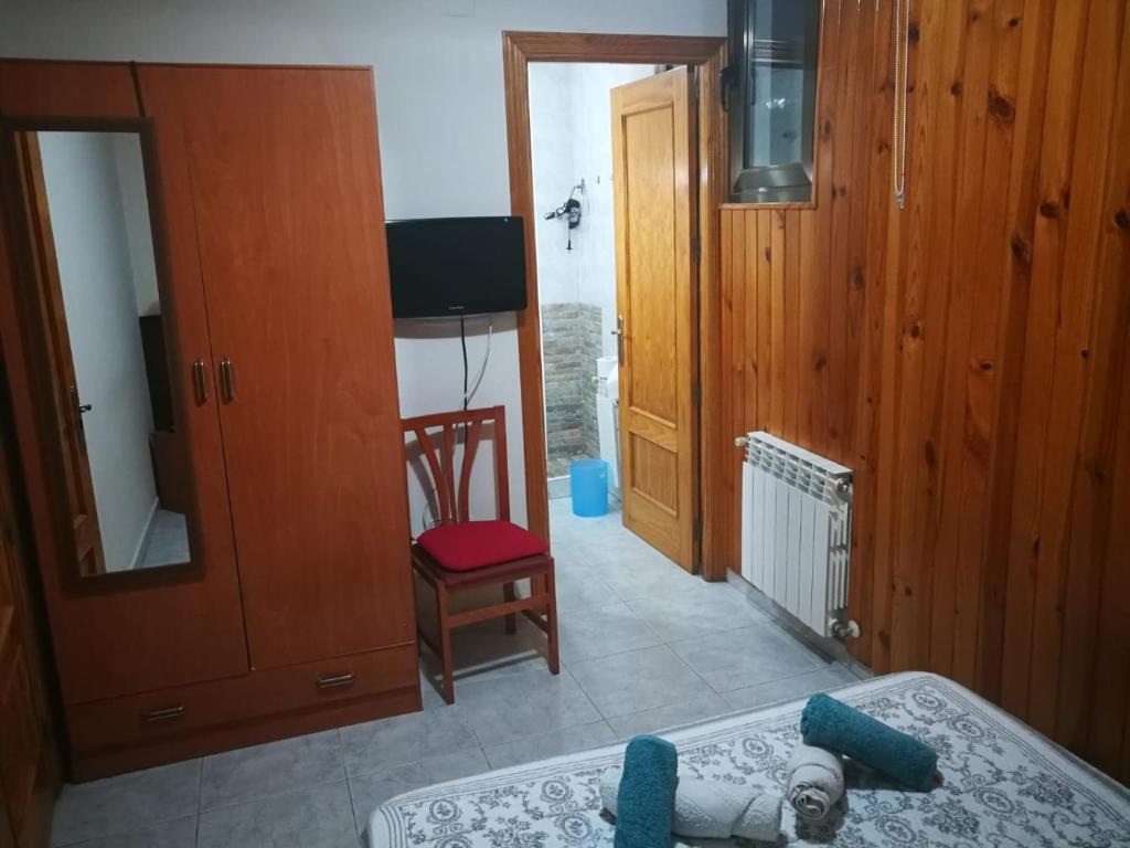 Postel nebo postele na pokoji v ubytování Hostal Escarla