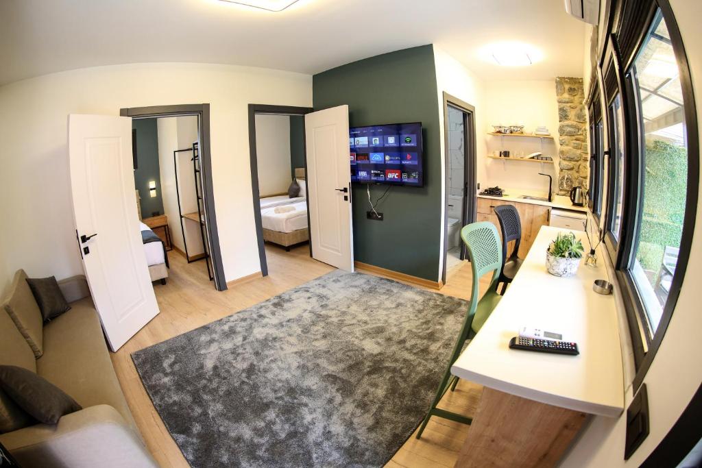 a small room with a living room with a table at Mia Mia Suites in Istanbul