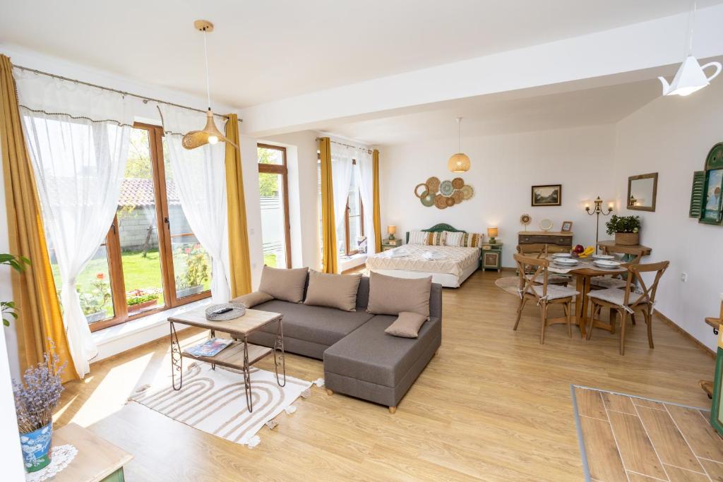 a living room with a couch and a table at Guests house Provence in Kavarna