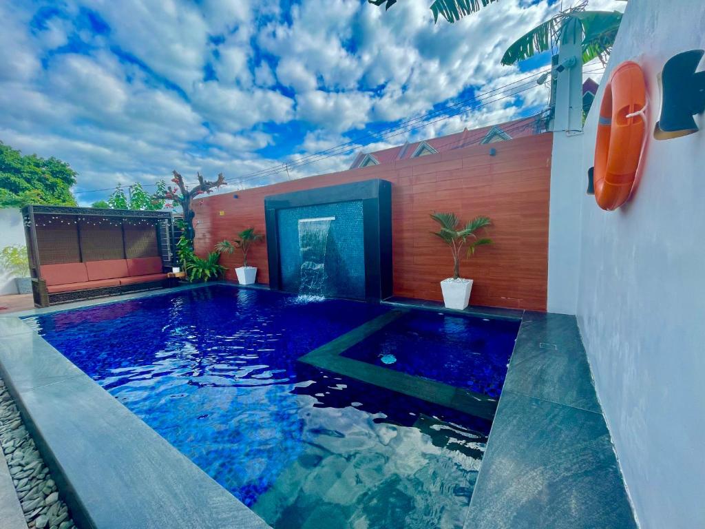 a swimming pool in the middle of a house at K-Residences Private Pool in Angeles