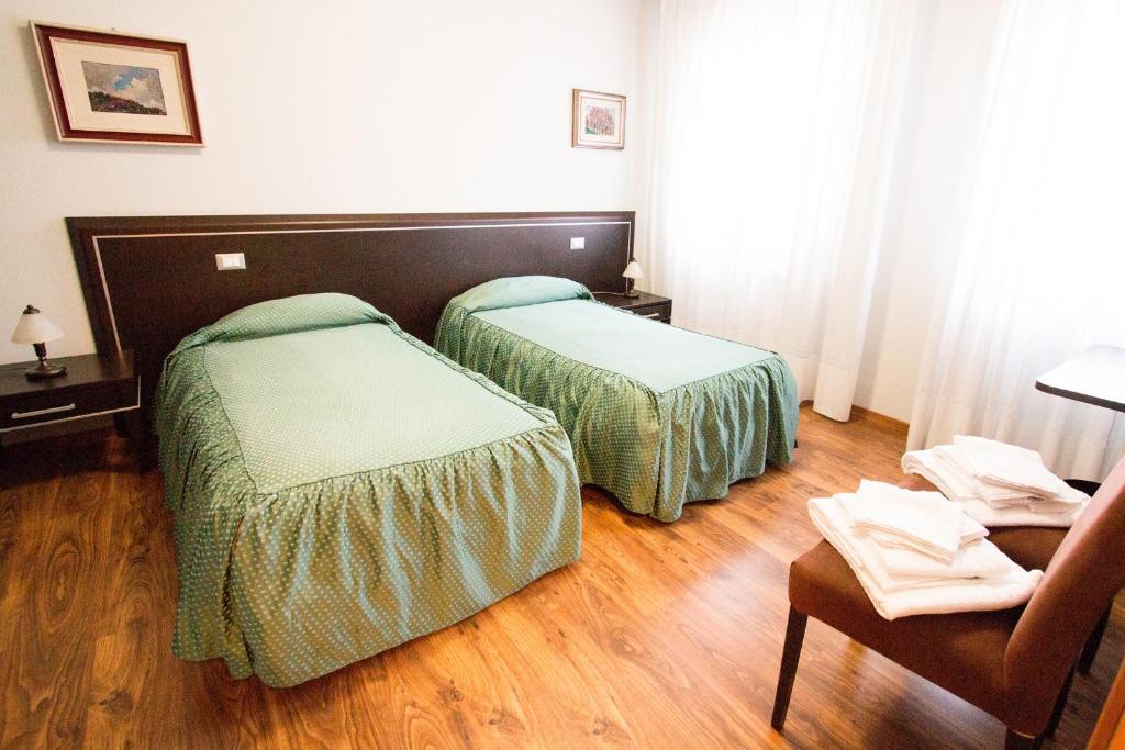 Postel nebo postele na pokoji v ubytování Al Benvenuto Hotel & Restaurant