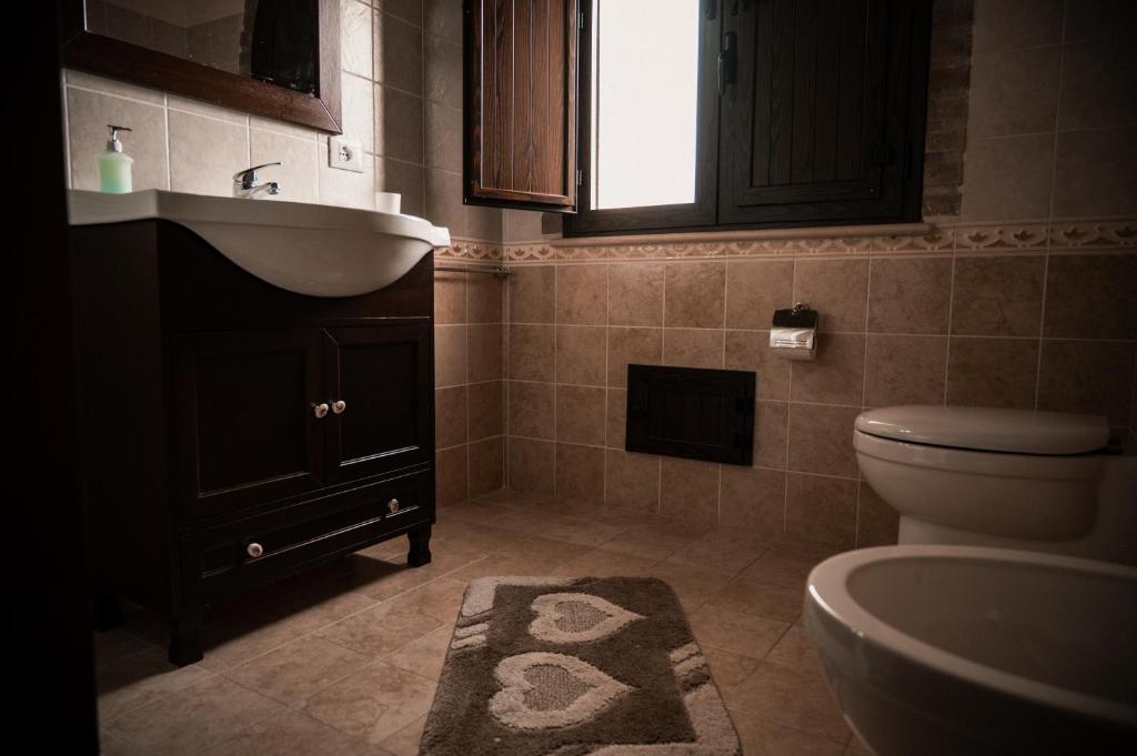 Koupelna v ubytování Agriturismo L'Antico Casale