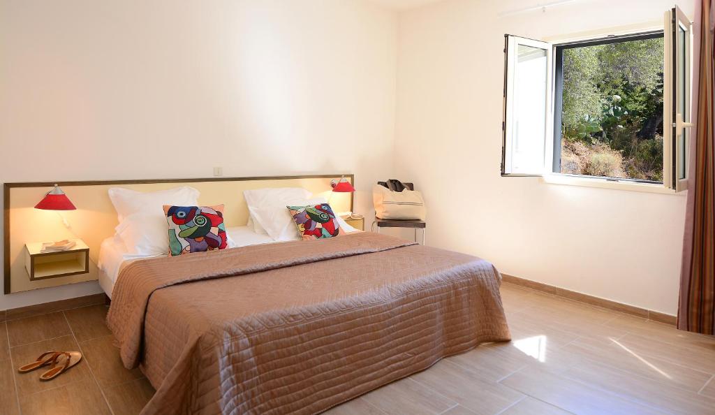 Postel nebo postele na pokoji v ubytování Hotel Les Eucalyptus