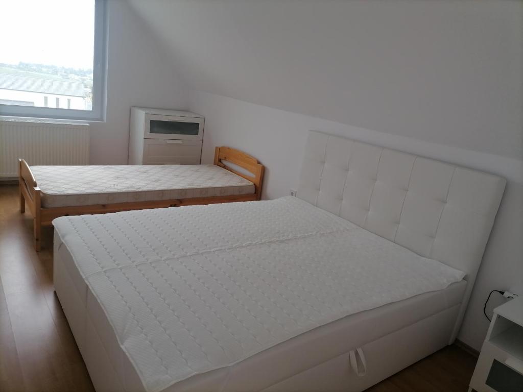 Postel nebo postele na pokoji v ubytování Mesgye Villa