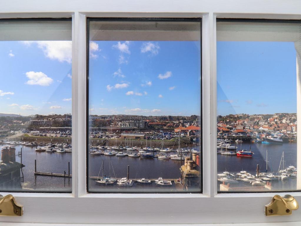 a window with a view of a harbor at Navigators Rest in Whitby