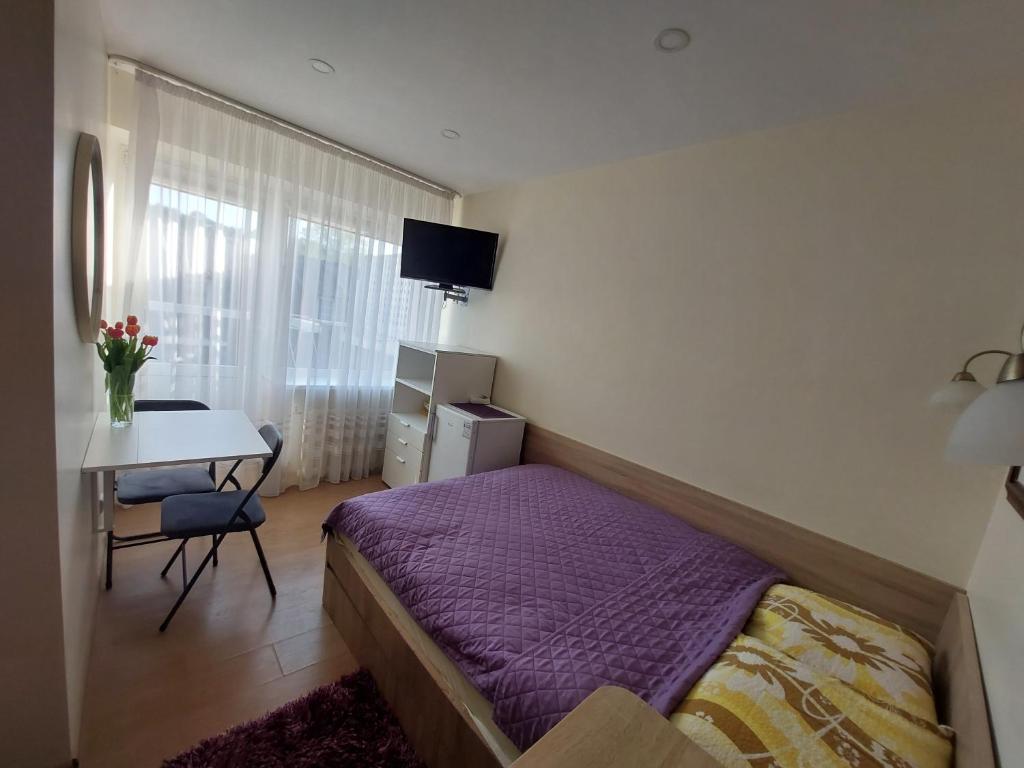 Postel nebo postele na pokoji v ubytování Nida guesthouse at Loreta