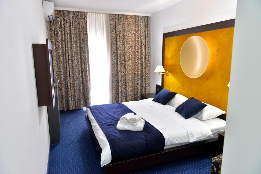 Postel nebo postele na pokoji v ubytování Apartments 29