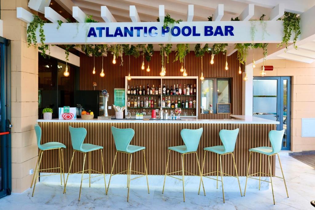 a bar with chairs at anatlantic pool bar at Lagos Atlantic Hotel in Lagos
