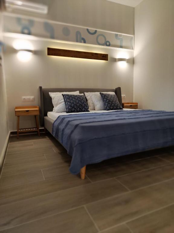 Postel nebo postele na pokoji v ubytování Coritos apartments 2 Corfu