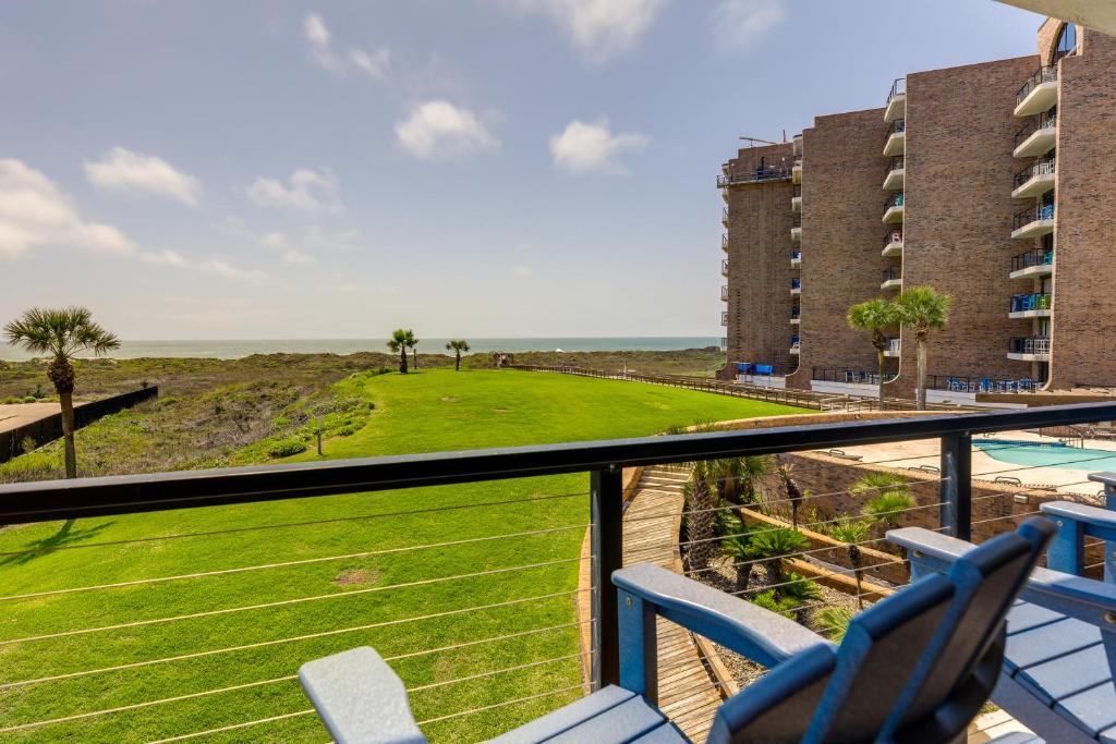 a balcony with chairs and a view of the ocean at Port Aransas Vacation Rental with Pools - Near Beach in Port Aransas