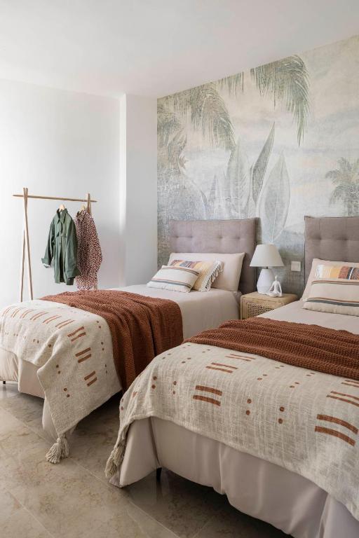 Postel nebo postele na pokoji v ubytování Small Oasis P&O Serviced Apartments