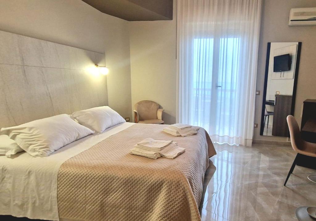 Posteľ alebo postele v izbe v ubytovaní Hotel Sole