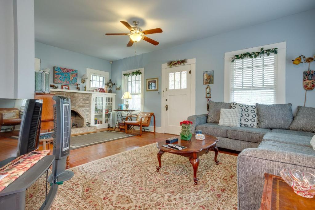 a living room with a couch and a table at Charming Canyon Lake Cottage w/ Pool & BBQ Pit! in Canyon Lake