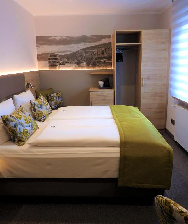 Postel nebo postele na pokoji v ubytování Hotel Rose