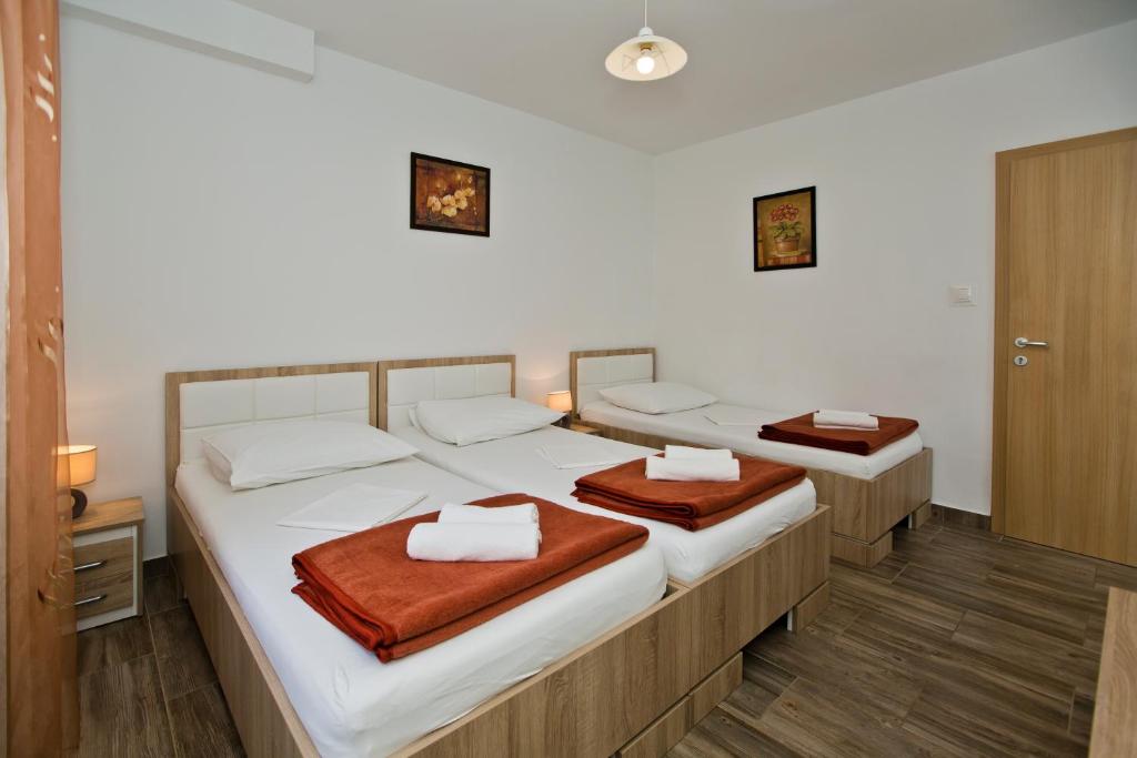 Postel nebo postele na pokoji v ubytování Guesthouse Aurora
