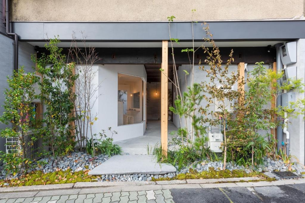 a building with plants on the side of it at Ryokan Nishijin - Vacation STAY 46289v in Kyoto