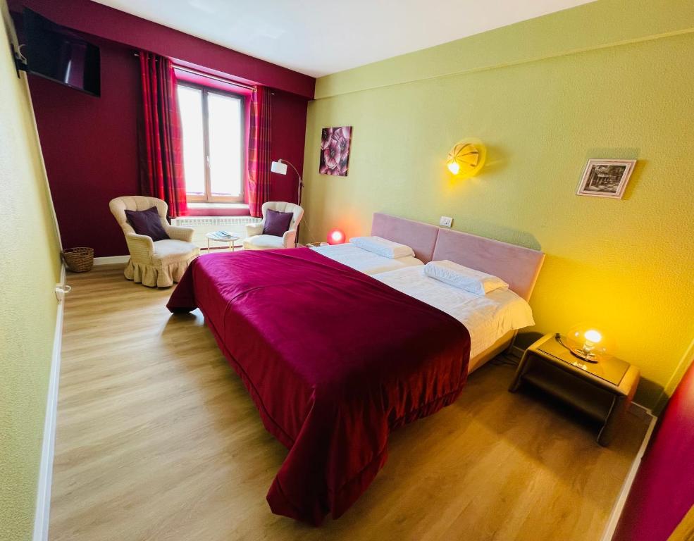 Postel nebo postele na pokoji v ubytování Hostellerie Sainte-Cécile
