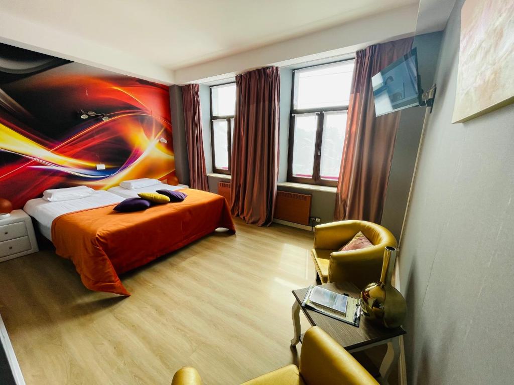 Postel nebo postele na pokoji v ubytování Hostellerie Sainte-Cécile
