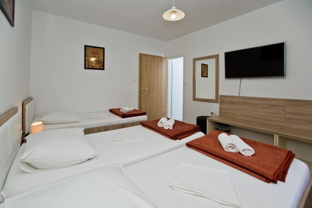 Postel nebo postele na pokoji v ubytování Guesthouse Aurora