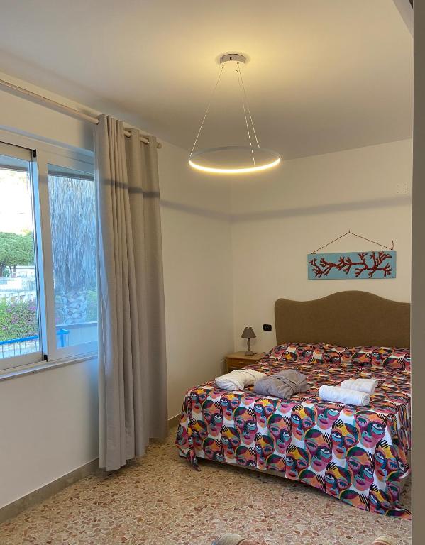 A bed or beds in a room at Villa Savoia Mondello