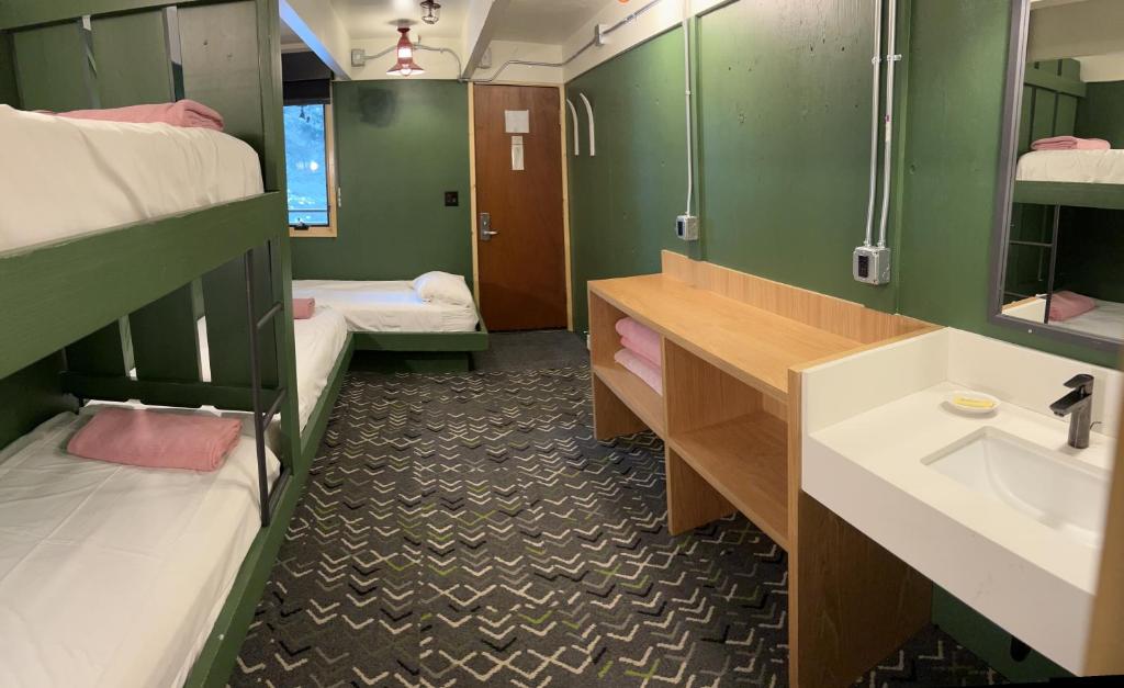 a bathroom with two bunk beds and a sink at The Hostel in Teton Village