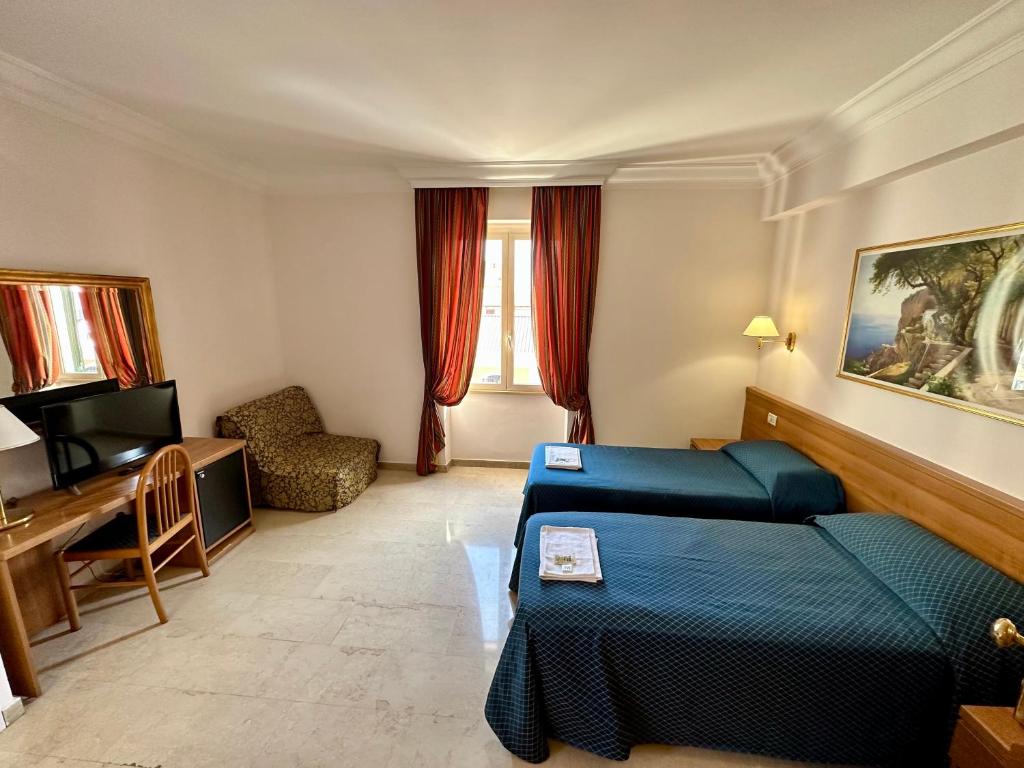 Postel nebo postele na pokoji v ubytování Hotel Principe Di Piemonte
