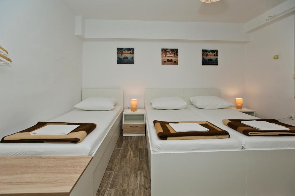 Postel nebo postele na pokoji v ubytování Guesthouse Aurora