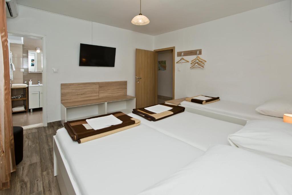 Postel nebo postele na pokoji v ubytování Guesthouse Aurora